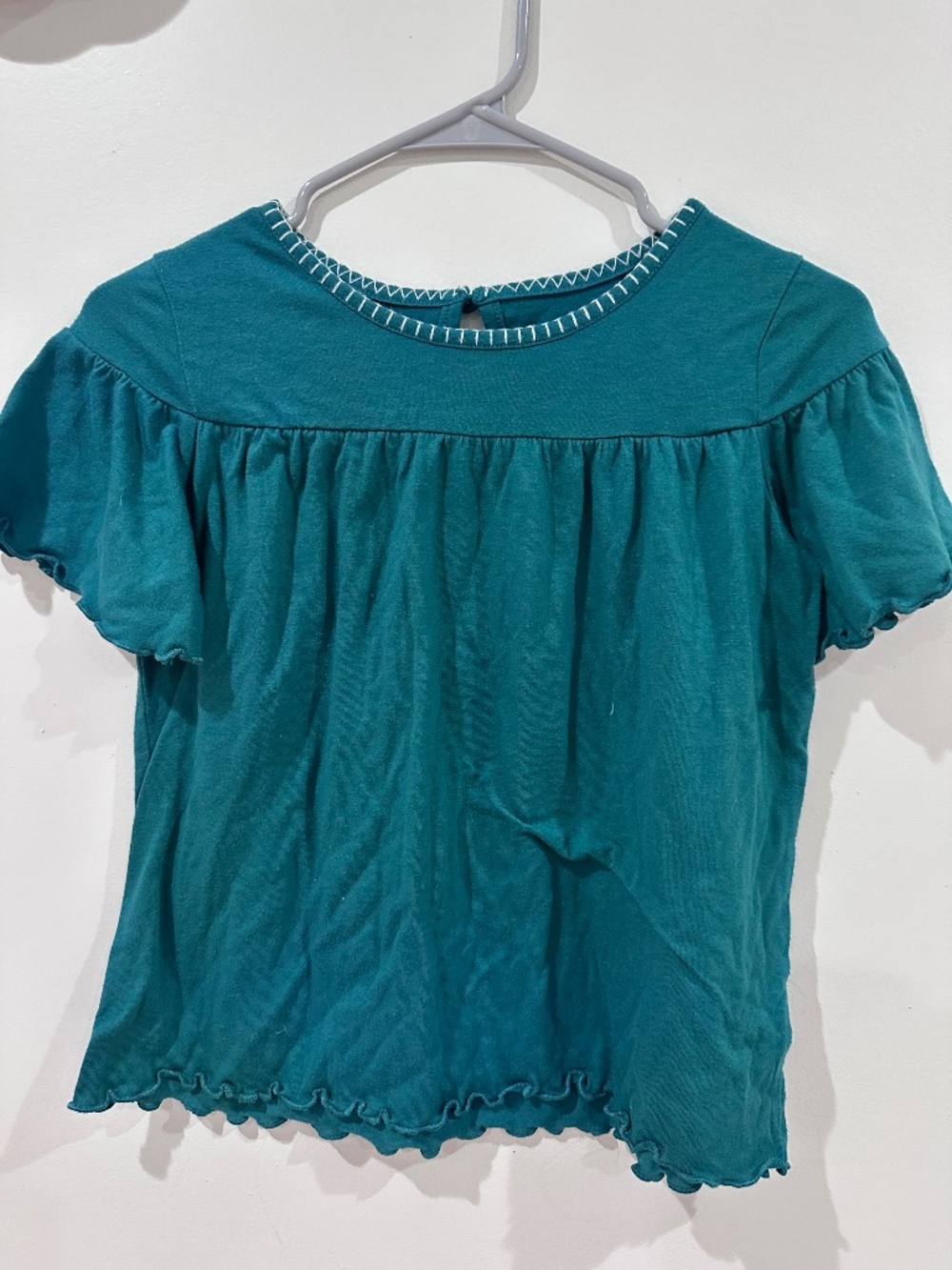teal shirt